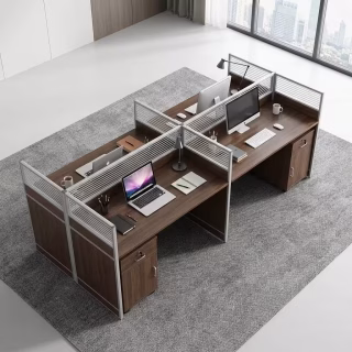 Modern 4-way office workstation desk cluster in dark walnut wood grain with frosted glass privacy screen dividers and integrated lockable storage drawers.