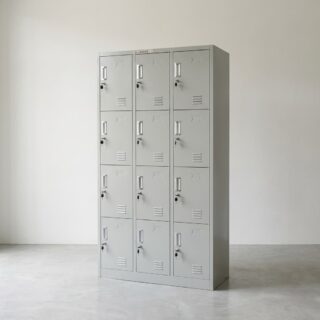 A tall, light grey steel Commercial 12-Door Employee Locker unit featuring twelve individual locking doors arranged in three vertical columns with ventilation slots.