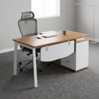 Modern executive L-shaped office desk featuring a natural wood-grain top, white metal frame, integrated white side storage drawers, and a white front modesty panel, paired with a high-back grey mesh ergonomic office chair with a five-star wheeled base.