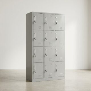 A tall, grey steel 12-Door Metal Storage Locker unit featuring twelve individual locking doors arranged in three vertical columns with ventilation slots and keys inserted in the locks.