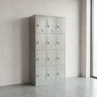 A tall, light grey steel 12-Door Metal Storage Locker unit featuring twelve individual locking doors arranged in three vertical columns with ventilation slots.