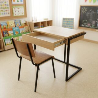 A light oak Kids Desk Chair Set featuring a single student desk with an open pull-out storage drawer, a matching wooden chair, and matte black steel frames.