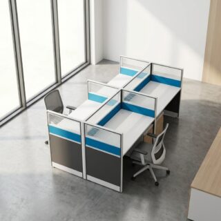 A modular 4-Person Office Workstation Desk featuring four white tabletops arranged in a back-to-back layout separated by grey, blue, and glass privacy partition screens.