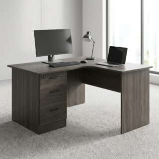 A dark ash wood grain L-Shaped Desk With Drawers featuring an integrated three-drawer file cabinet with a top drawer key lock, a curved corner workspace, and full-length wooden modesty panels.