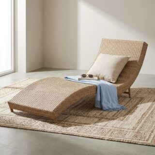 A light tan woven synthetic wicker Rattan Outdoor Chaise Lounge showing an S-curve contoured frame and low-profile integrated supportive legs.