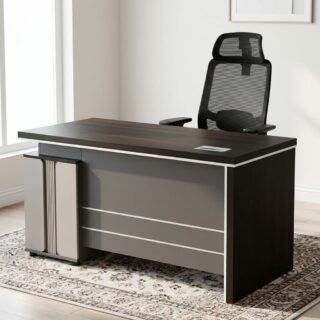A dark charcoal 1.4-meter executive office desk featuring a thick rectangular top surface, silver metallic accent lines along the front modesty panel, and an architectural beige stone-textured side pedestal cabinet.