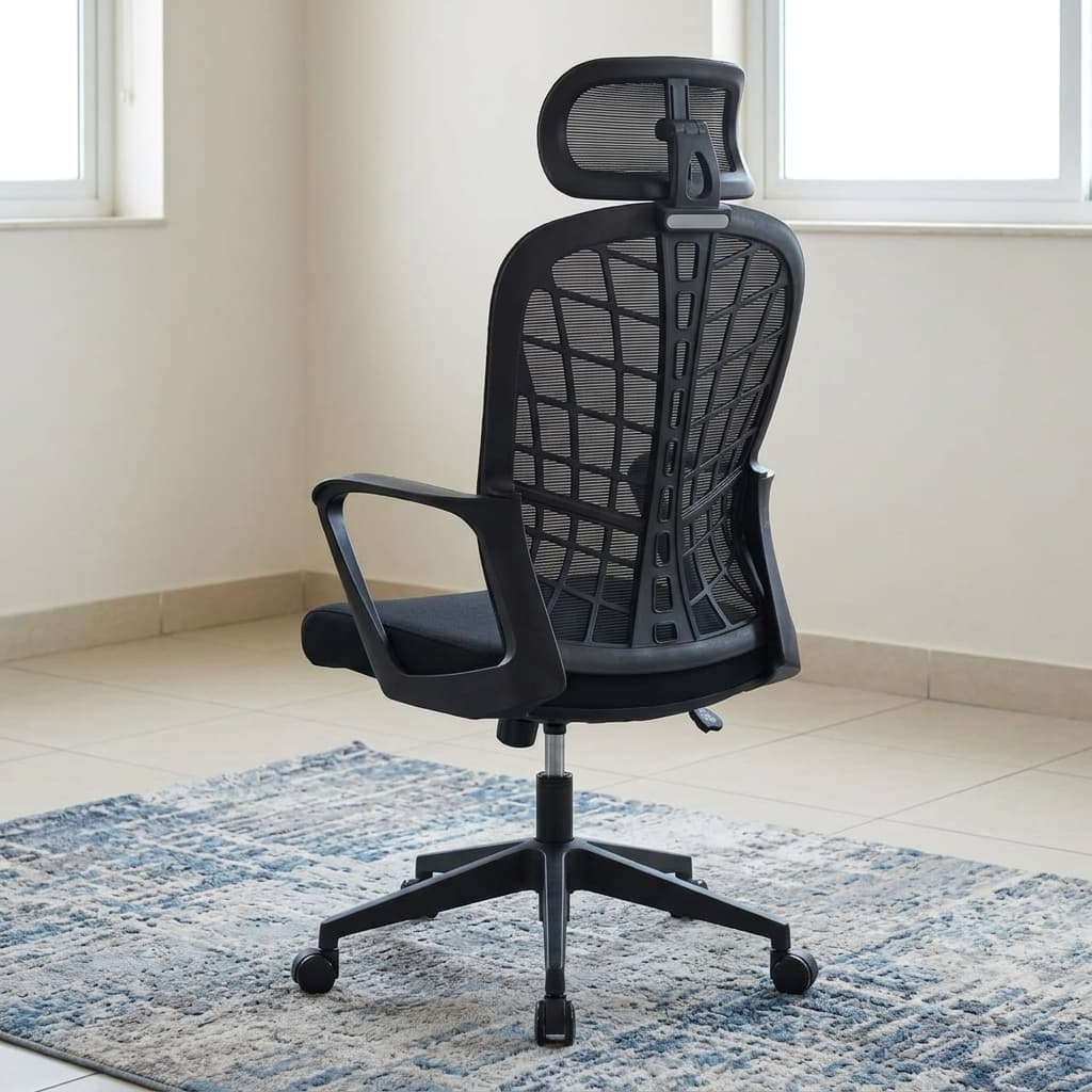 A black Ergonomic Mesh Office Chair featuring an adjustable mesh headrest, a contoured webbed mesh backrest, curved plastic armrests, a padded fabric seat cushion, and a five-star wheeled base.