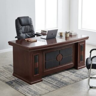A rich mahogany wood 1.8m Luxury Executive Desk featuring a black leather desktop writing pad insert, thick curved edge profiles, and geometric front modesty paneling with decorative glass vertical slats.