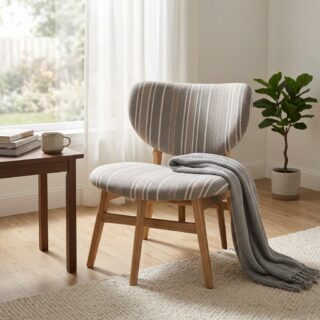 An armless Modern Stripe Accent Chair featuring grey fabric upholstery with vertical white stripes, a contoured backrest, and an angled solid natural oak wood frame.