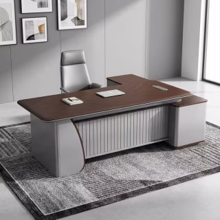 A dark walnut wood 2.2m Executive Office Desk featuring a built-in wireless charging pad, a fluted charcoal grey modesty panel, and a long integrated side return storage cabinet.
