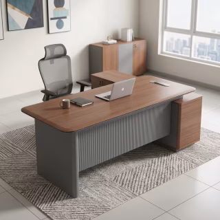 A walnut wood 1.8m Executive L-Shaped Desk featuring a fluted charcoal grey modesty panel, a curved desktop edge, and a matching long side return storage cabinet.